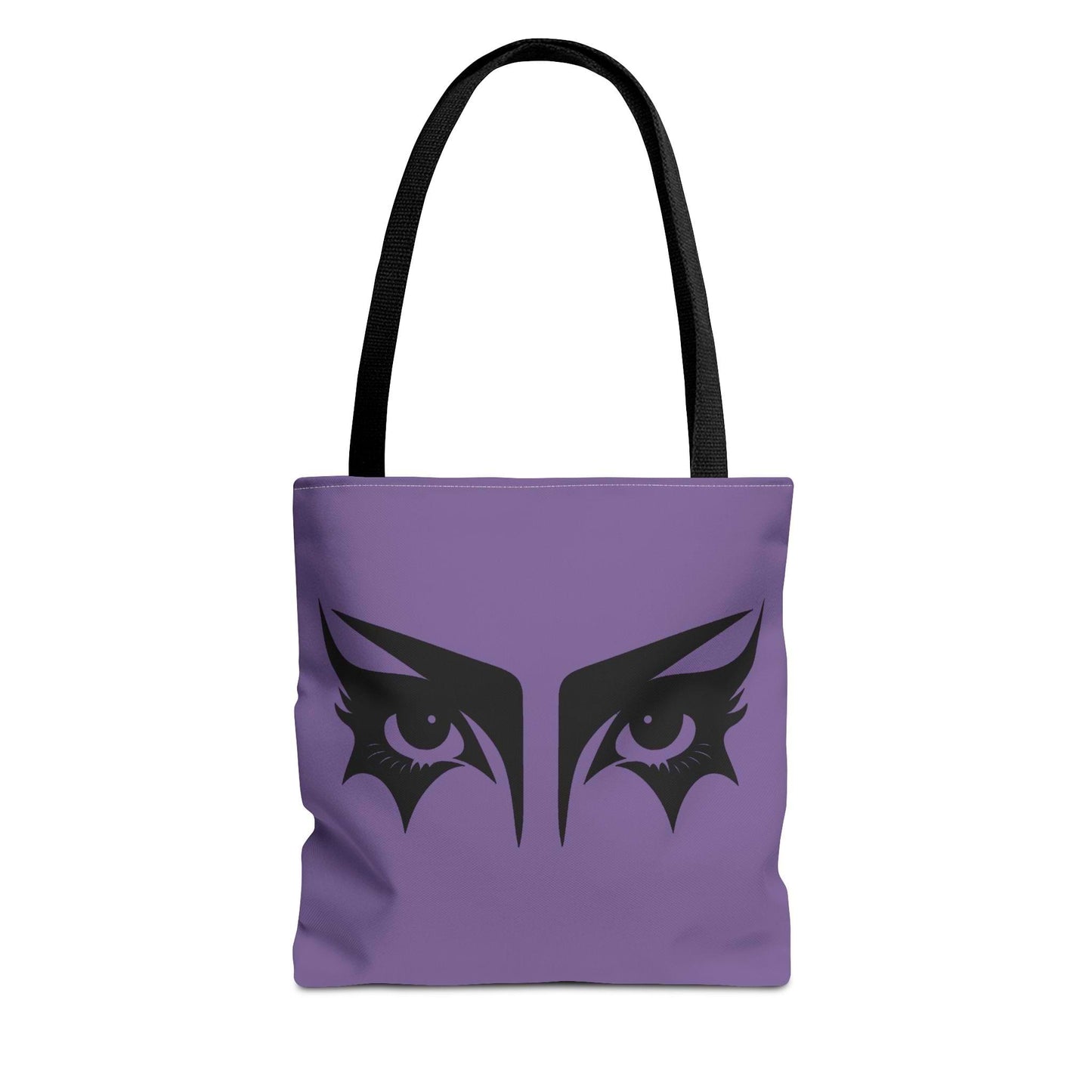A gothic tote bag that has an illustration of trad goth makeup against a lilac background with a black handle.
