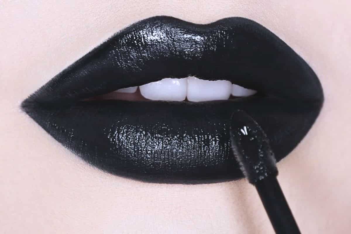 Black liquid lipstick on lips featured in a goth makeup review of the best black lipsticks at Ulta.