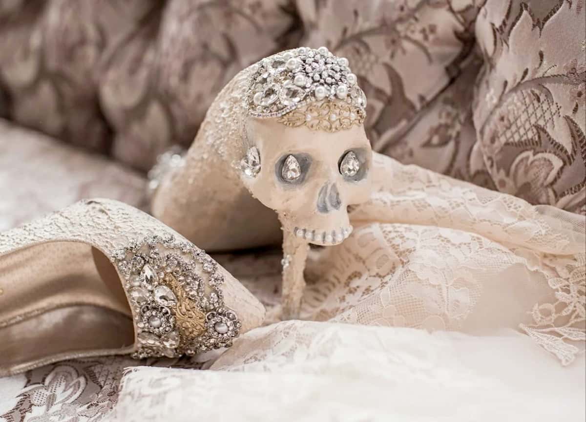 Skull-studded bridal heels by Zombie Peepshow, adorned with rhinestones and lace—perfect for a gothic bride with a desire for alternative bridal heels.