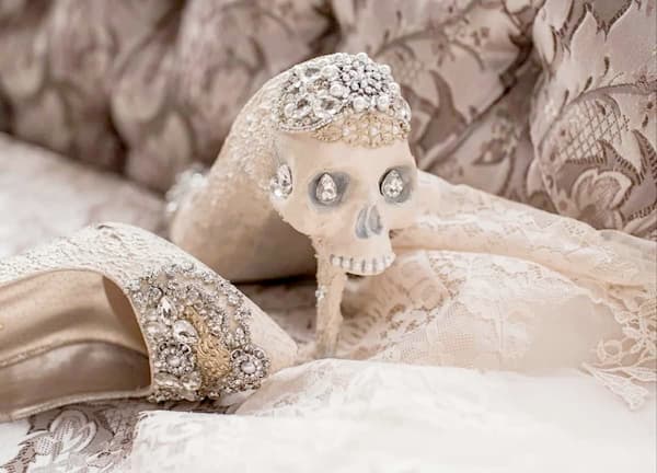 Skull-studded bridal heels by Zombie Peepshow, adorned with rhinestones and lace—perfect for a gothic bride with a desire for alternative bridal heels.