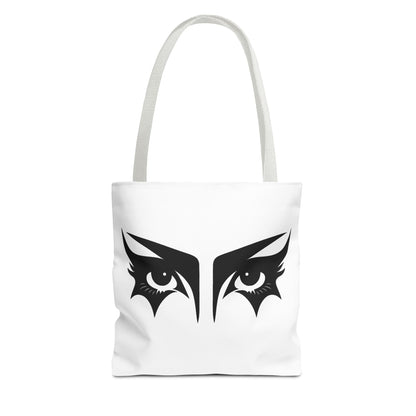 A gothic tote bag that has an illustration of trad goth makeup against a white background.